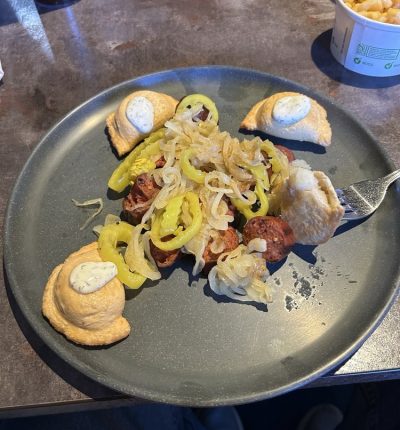 A plate filled with a variety of colorful foods, including vegetables, grains, and protein.